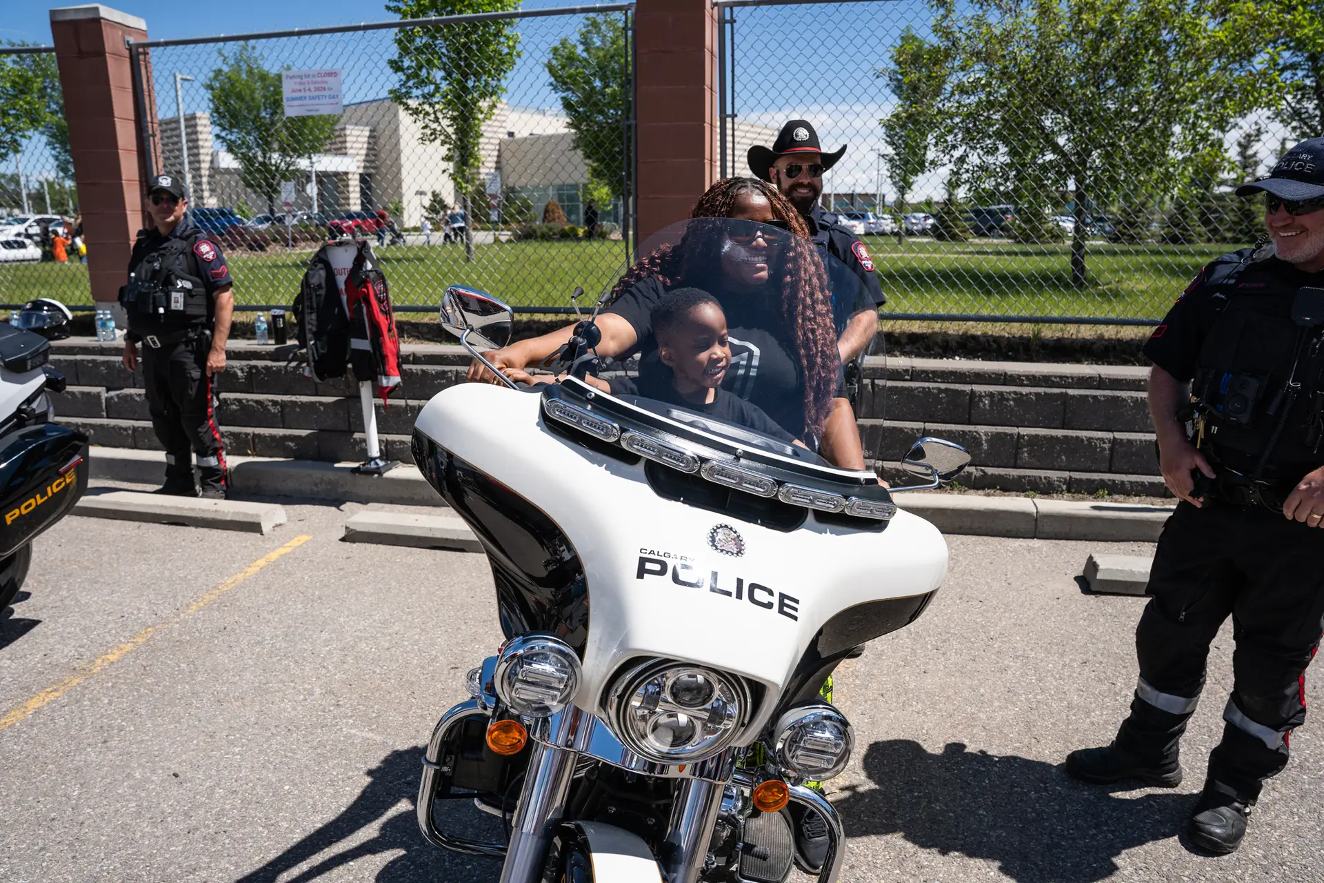 Mom and Son on Calgary Police Motorbike