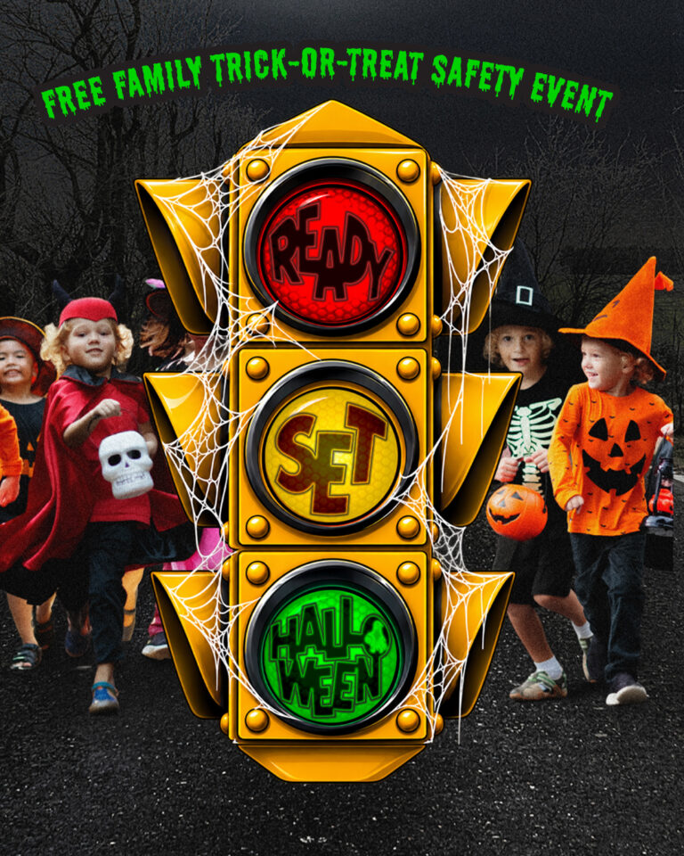 Free Halloween Safety Event. Traffic Light with Ready Set HAlloween written in the lights and kids walking don a spooky road.